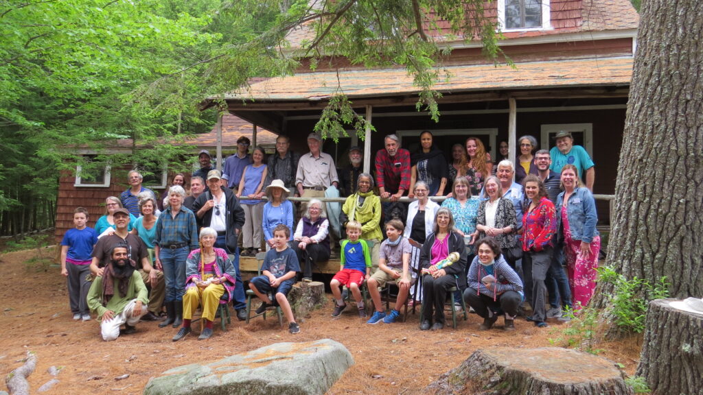 A Large group assembled on the porch of the lodge